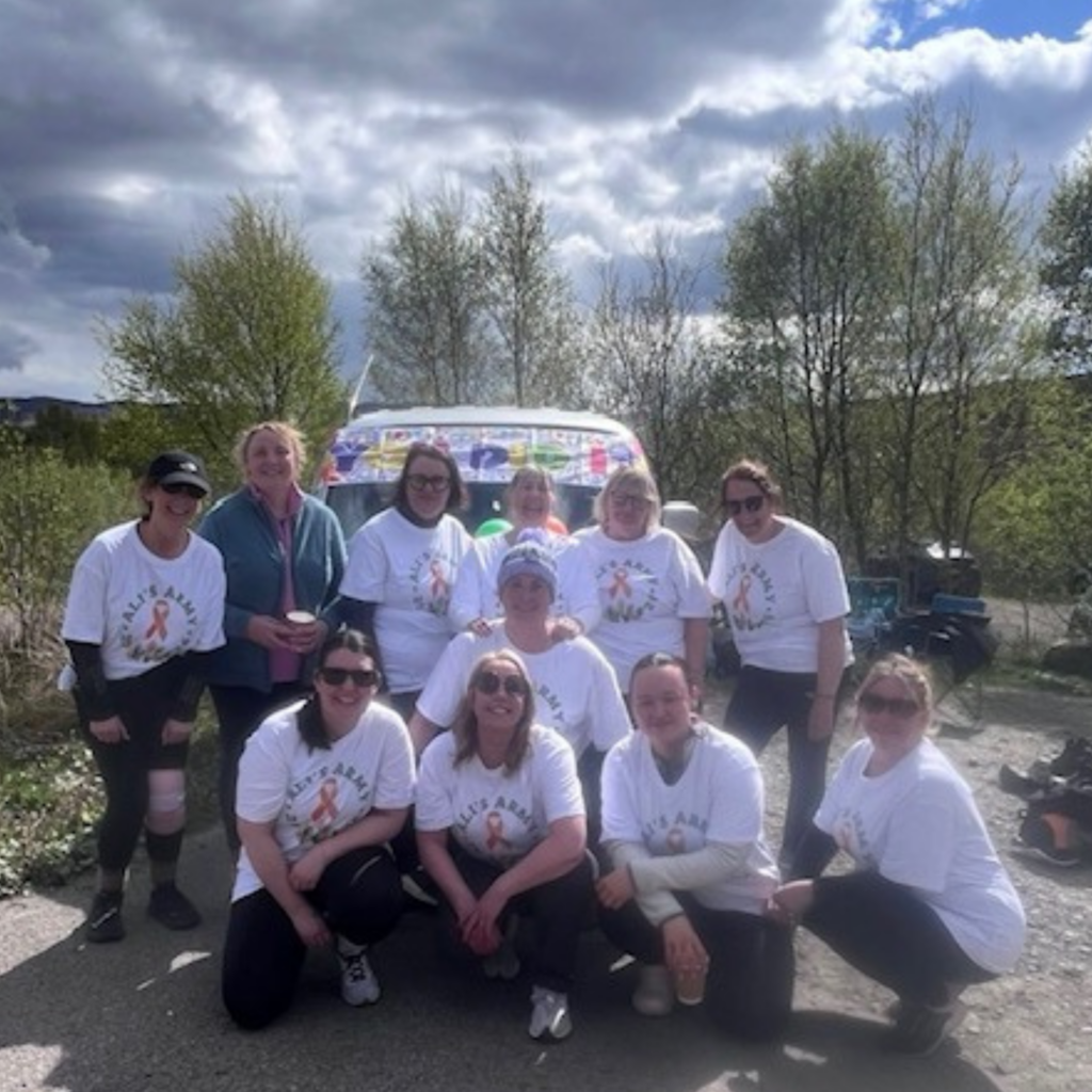 Image shows the reablement team in matching tshirts in the outdoors after completing a walk 