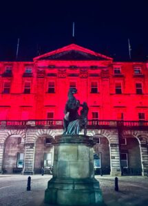 Edinburgh City Chambers lit with pink lights